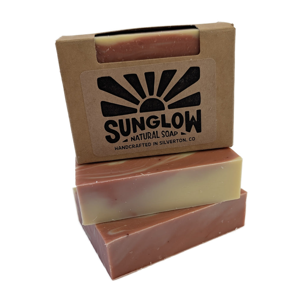 Alpenglow soap bars stacked with their kraft box