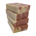 A stack of four Alpenglow soap bars