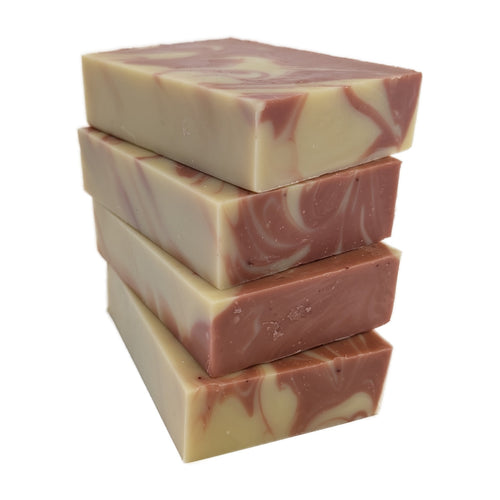 A stack of four Alpenglow soap bars